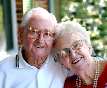 Photo of a man and woman smiling for a picture. Photo of a man and woman smiling for a picture.
