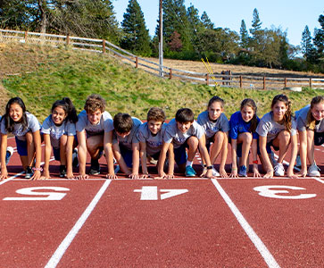 Students readying to race on the track field. Links to Beneficiary Designations Students readying to race on the track field. Links to Beneficiary Designations