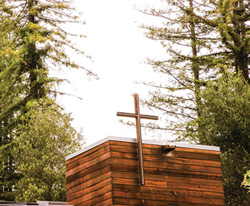 A cross on a building. Links to What to Give