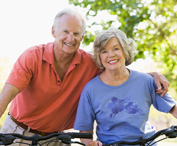 Photo of a man and woman smiling for a picture. Photo of a man and woman smiling for a picture.