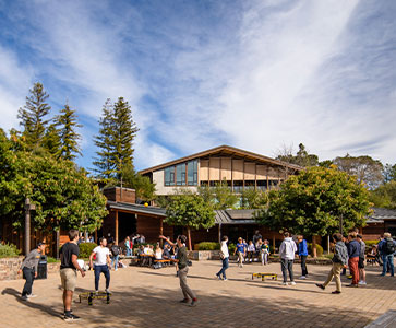 Students walking on campus. Links to Gifts from Retirement Plans